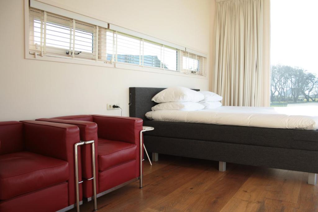 Postel nebo postele na pokoji v ubytování Hotel & Restaurant Weidumerhout