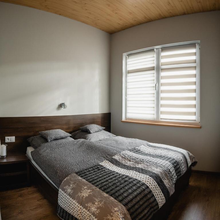 Posteľ alebo postele v izbe v ubytovaní Apartamenty TRZY KOLORY