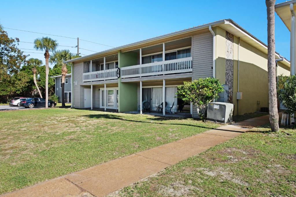 a house with a lawn in front of it at Gulf Terrace 181 in Destin