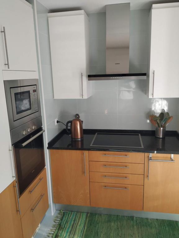 Kuchyň nebo kuchyňský kout v ubytování Apartamento Marina Olhão