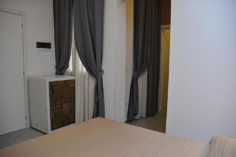 A bed or beds in a room at B&B Il Sole