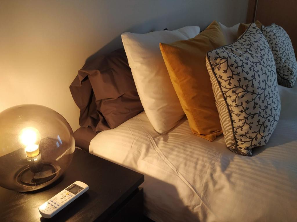 Postel nebo postele na pokoji v ubytování Apartamento Marina Olhão
