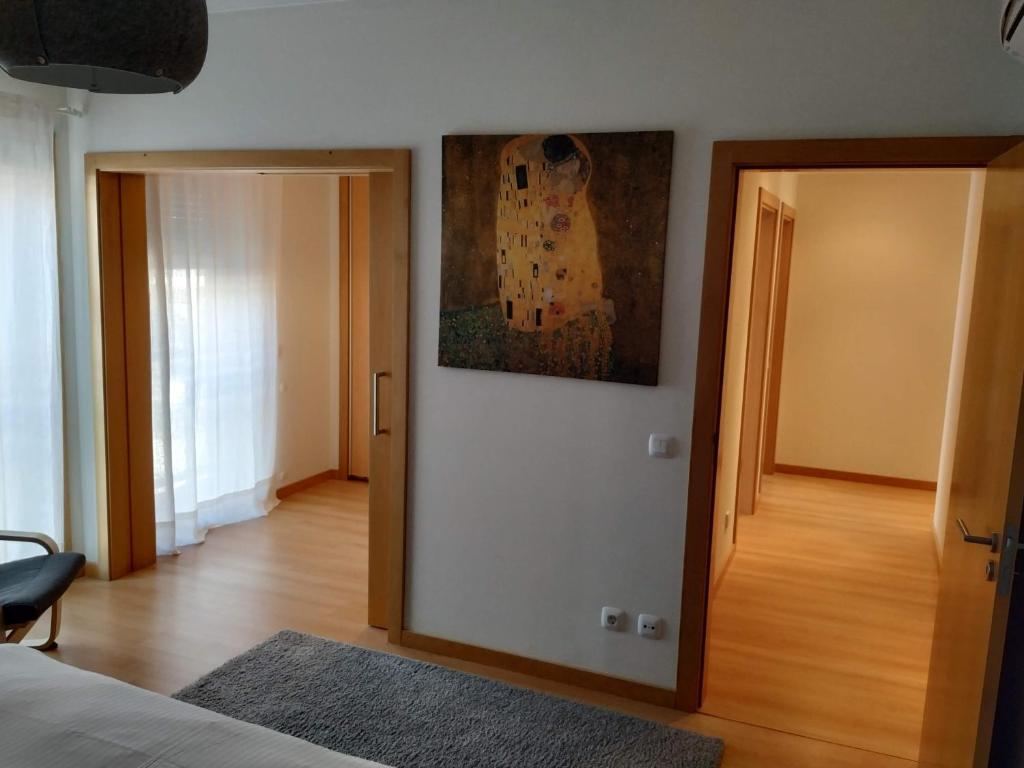 Postel nebo postele na pokoji v ubytování Apartamento Marina Olhão