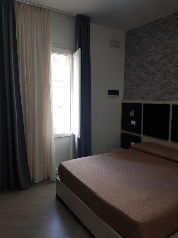A bed or beds in a room at B&B Il Sole