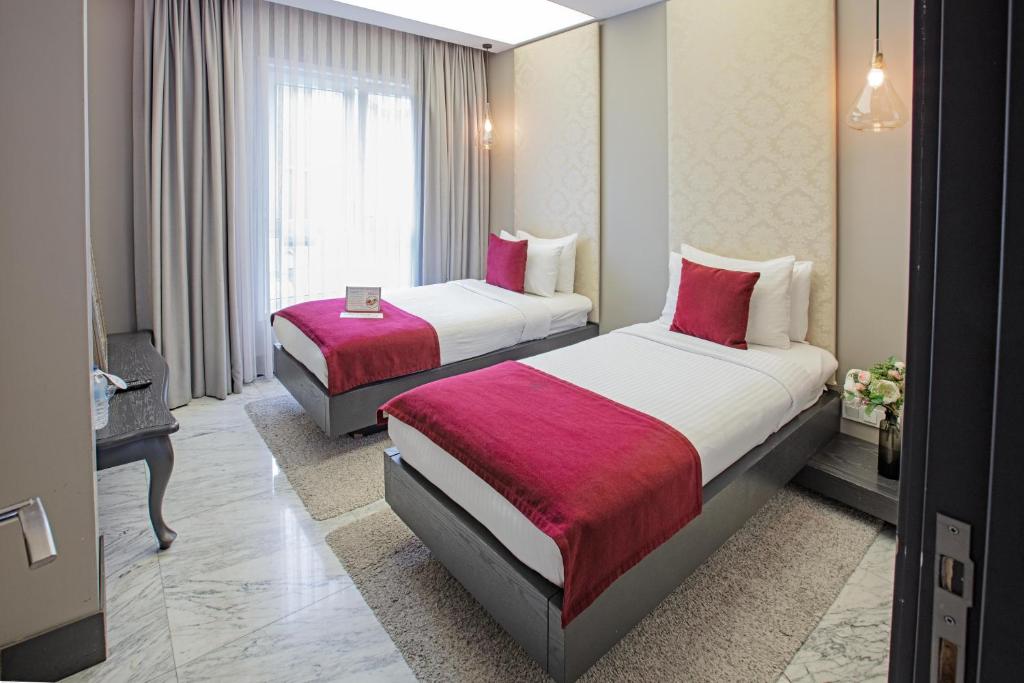 Postel nebo postele na pokoji v ubytování Nowy Efendi Hotel - Special Category