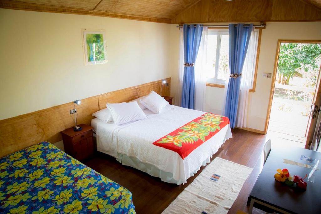 Postel nebo postele na pokoji v ubytování Hotel Taura'a