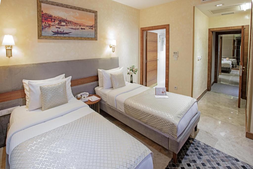 Postel nebo postele na pokoji v ubytování Nowy Efendi Hotel - Special Category