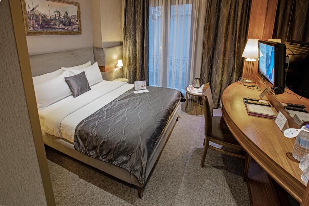Postel nebo postele na pokoji v ubytování Nowy Efendi Hotel - Special Category