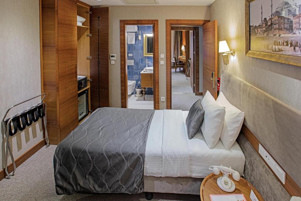 Postel nebo postele na pokoji v ubytování Nowy Efendi Hotel - Special Category