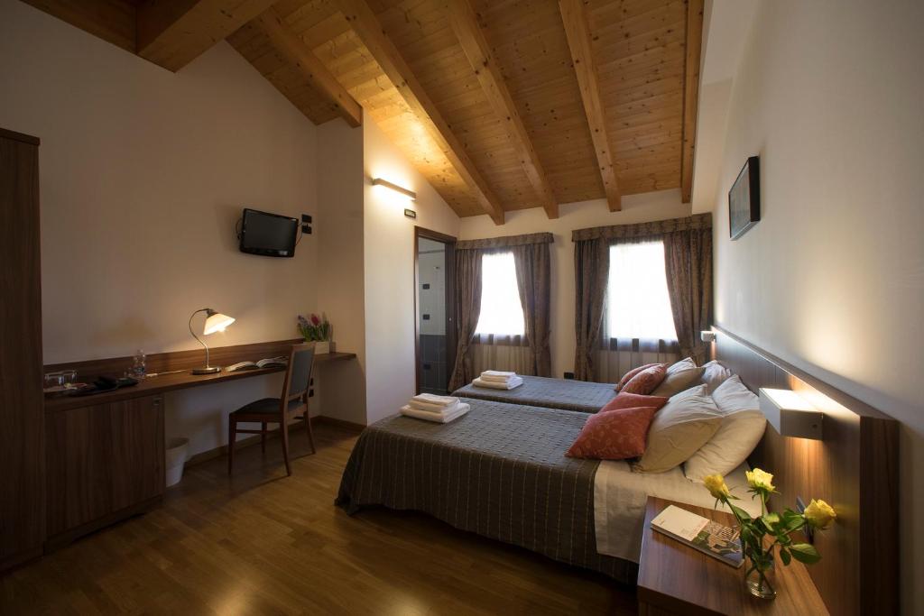 Posteľ alebo postele v izbe v ubytovaní Hotel C25