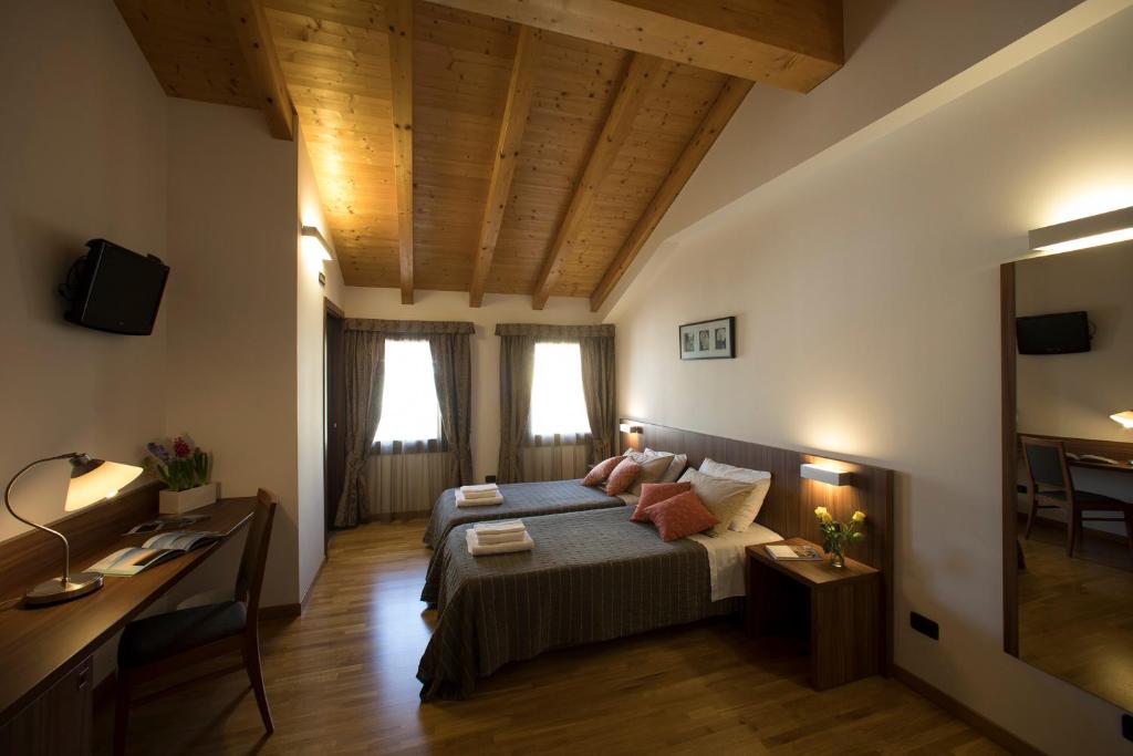 Posteľ alebo postele v izbe v ubytovaní Hotel C25