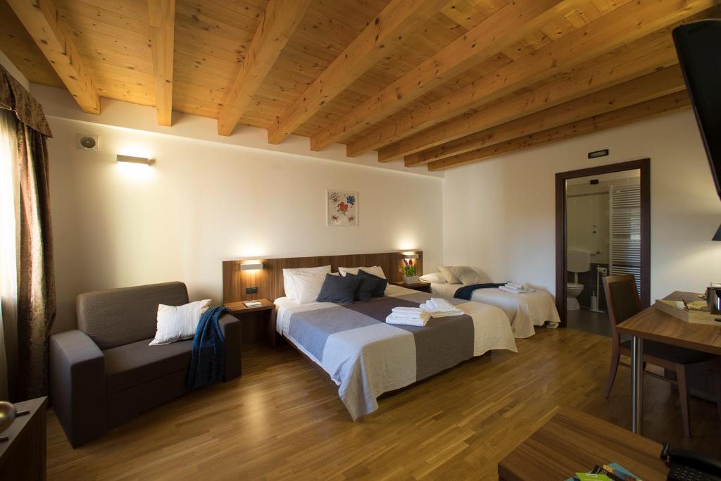Posteľ alebo postele v izbe v ubytovaní Hotel C25