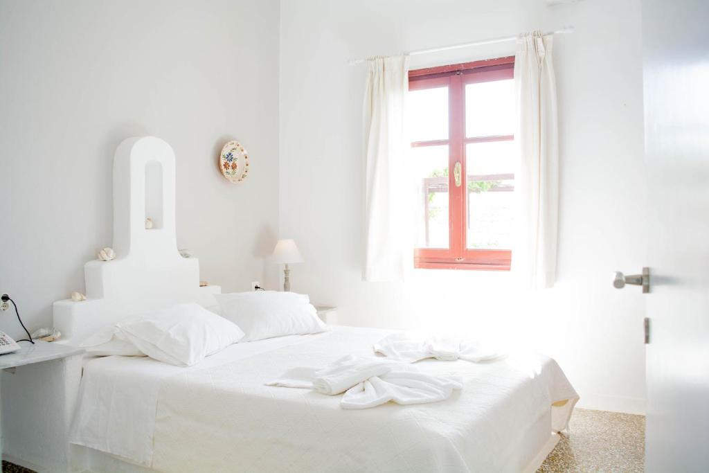 Postel nebo postele na pokoji v ubytování Bungalows Svoronos