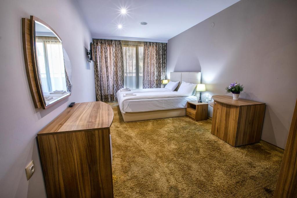 Postel nebo postele na pokoji v ubytování Hotel Andon Angelov