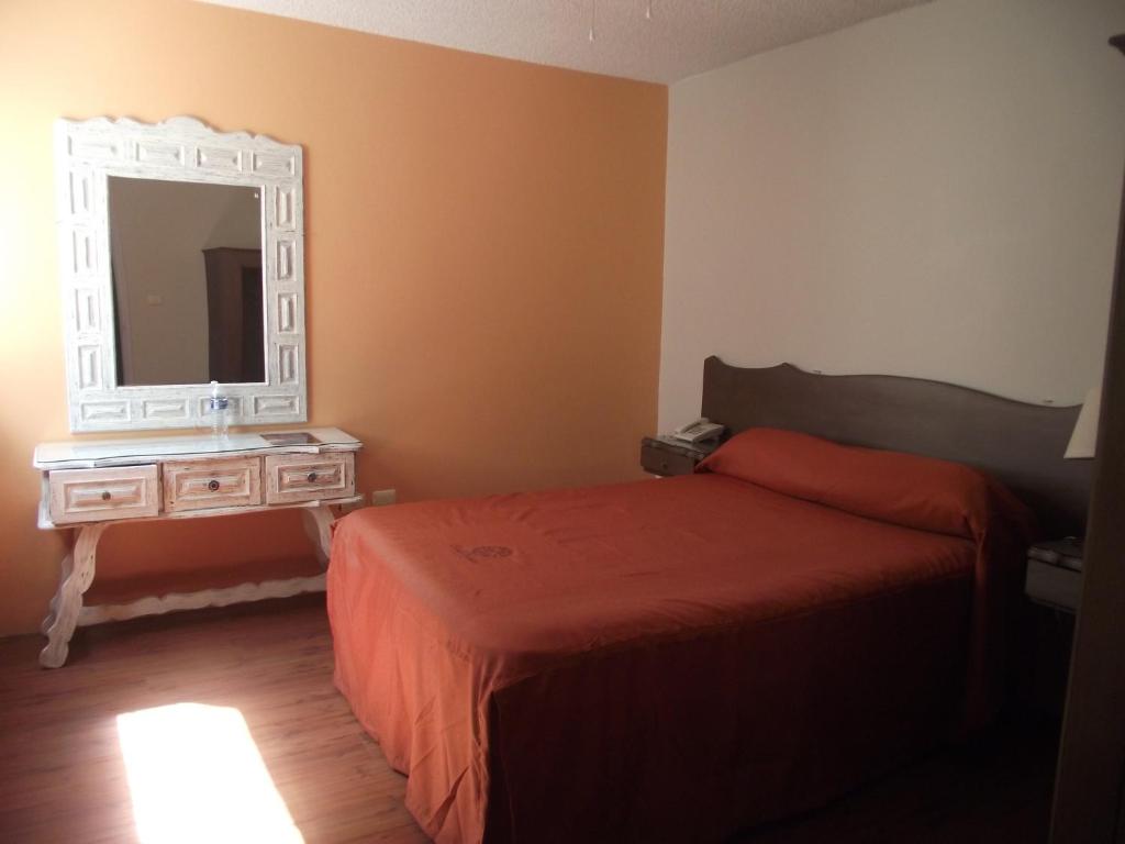 Postel nebo postele na pokoji v ubytování Hotel Palacio
