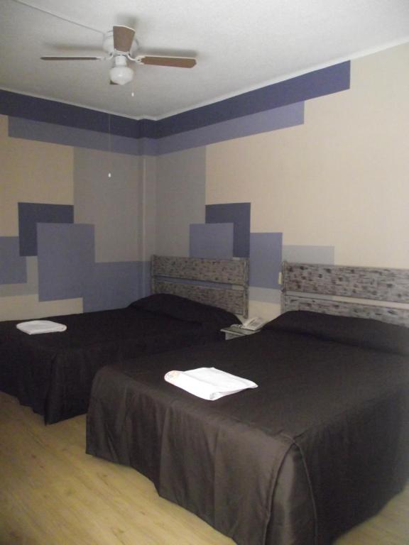 Postel nebo postele na pokoji v ubytování Hotel Palacio