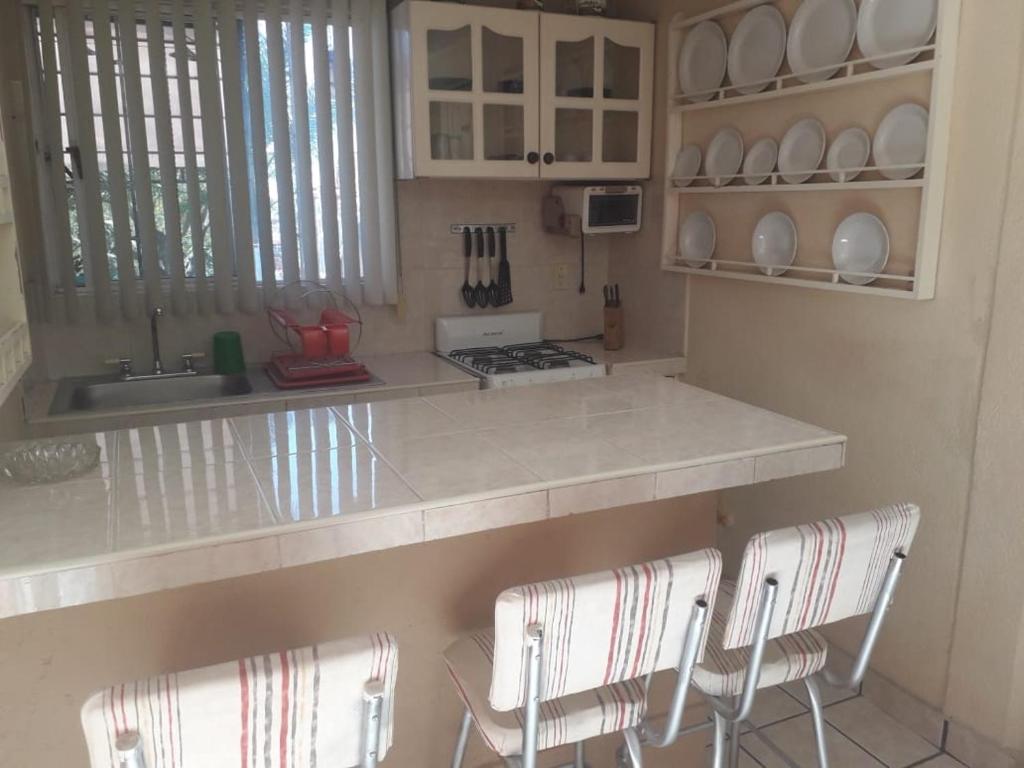 Kuchyň nebo kuchyňský kout v ubytování Villa Paraiso