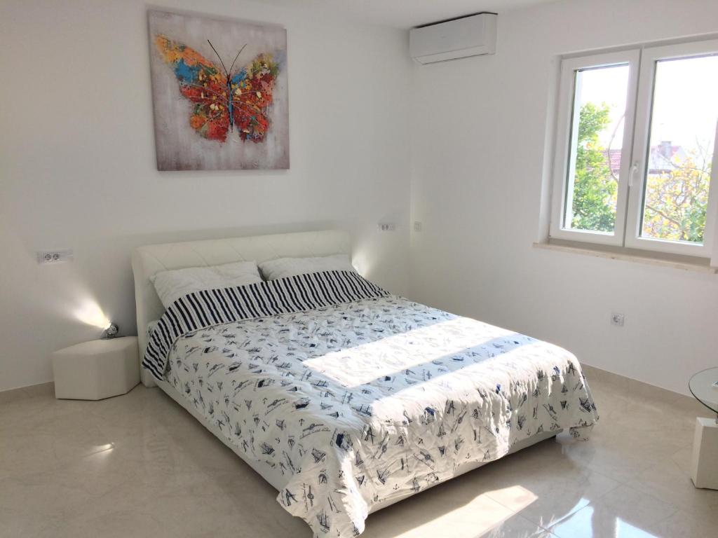 Posteľ alebo postele v izbe v ubytovaní Apartment Marina Komiza