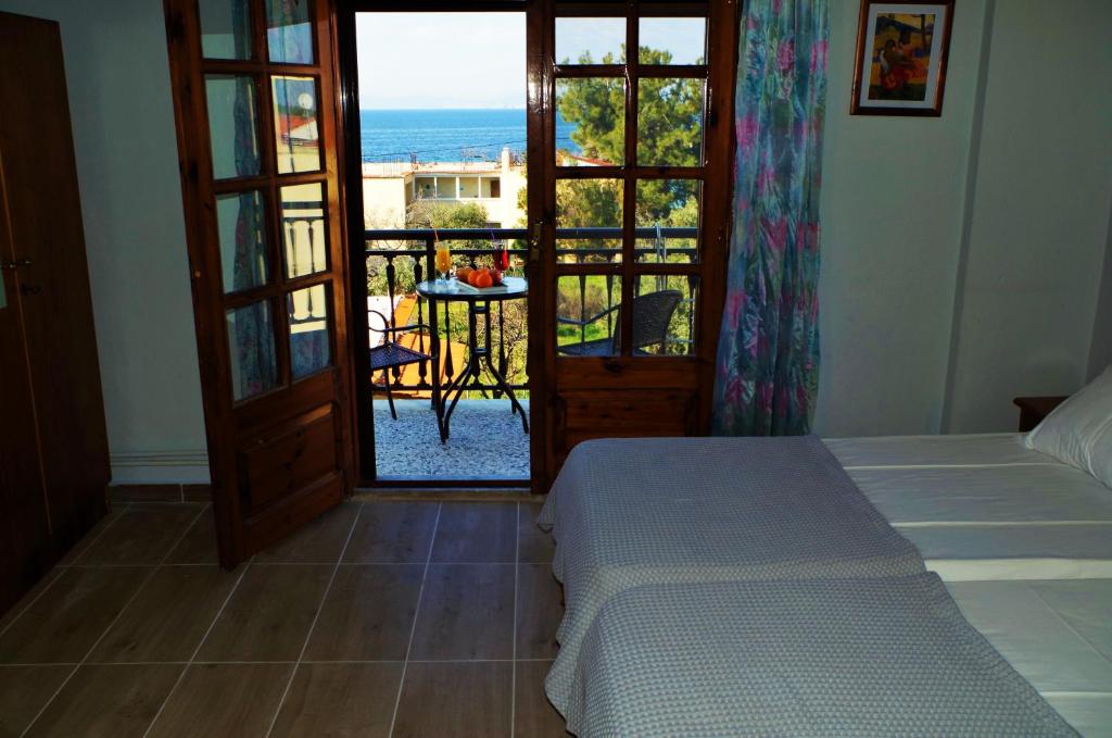 Postel nebo postele na pokoji v ubytování Sotiras Rooms