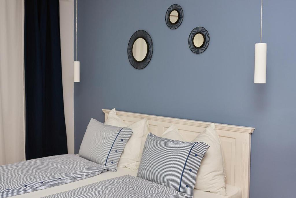 Postel nebo postele na pokoji v ubytování Logis 11 Apartments