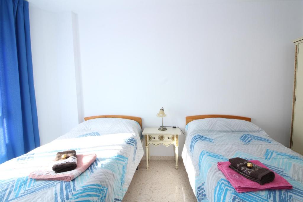 A bed or beds in a room at Beach and Family