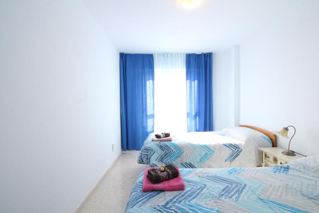 A bed or beds in a room at Beach and Family