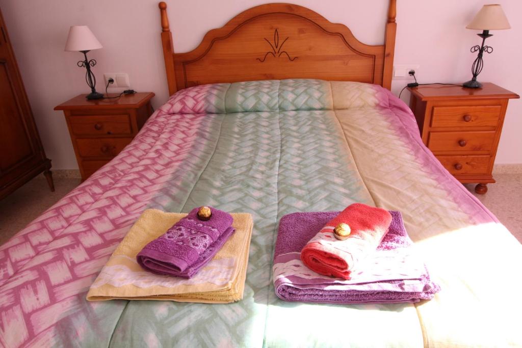 A bed or beds in a room at Beach and Family