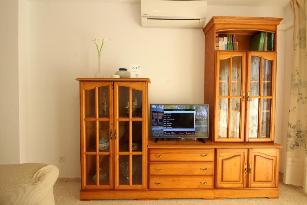 A television and/or entertainment centre at Beach and Family
