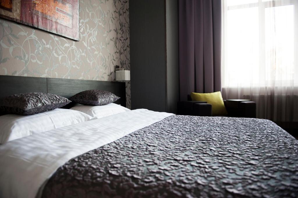 Postel nebo postele na pokoji v ubytování Boutique Apart - Hotel iArcadia