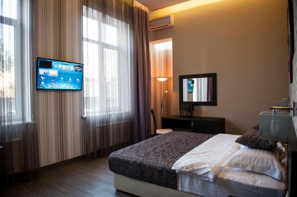 Postel nebo postele na pokoji v ubytování Boutique Apart - Hotel iArcadia
