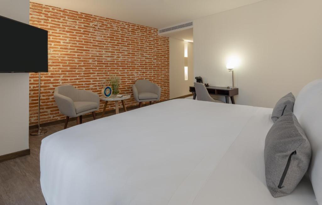 Postel nebo postele na pokoji v ubytování Hotel Santa Catalina