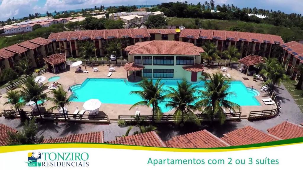 an aerial view of a resort with a swimming pool at Porto seguro Residencial Jerusalem 1 in Porto Seguro