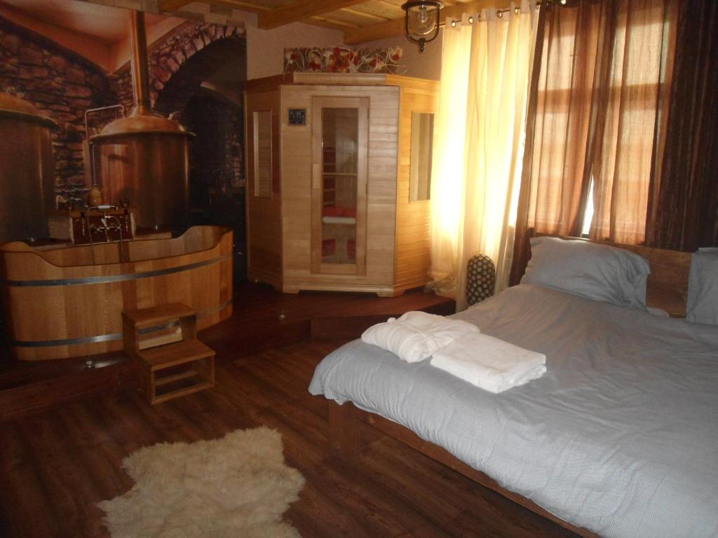 מיטה או מיטות בחדר ב-Luxusni Apartmany Stodolni