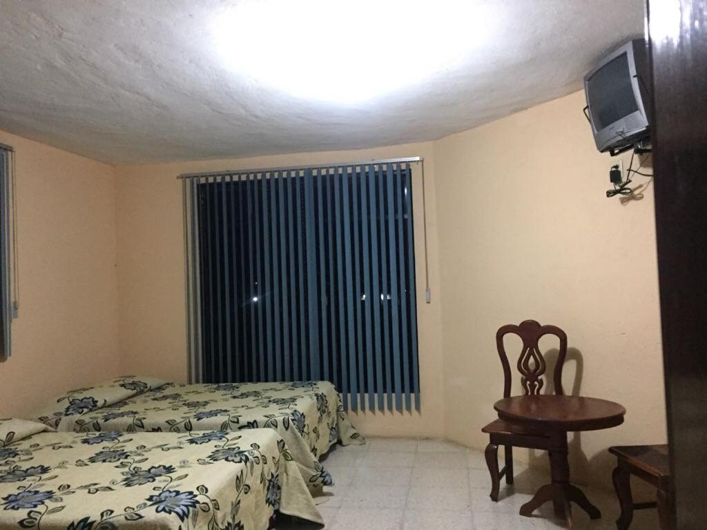 Postel nebo postele na pokoji v ubytování Hotel Lienzo Charro 1