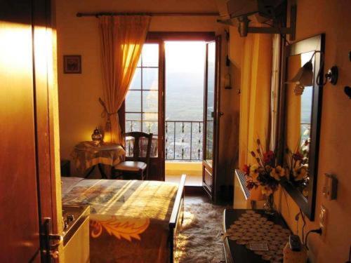 A bed or beds in a room at Gerakofolia Rooms to Let