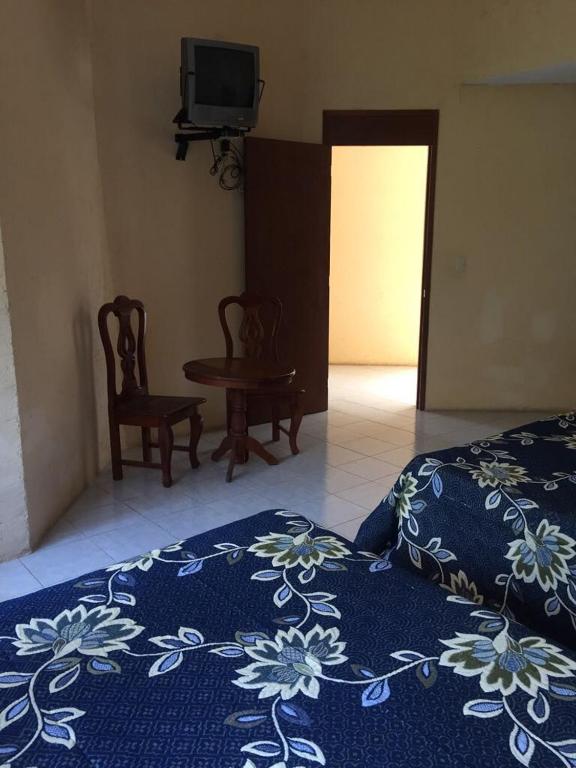 Postel nebo postele na pokoji v ubytování Hotel Lienzo Charro 1