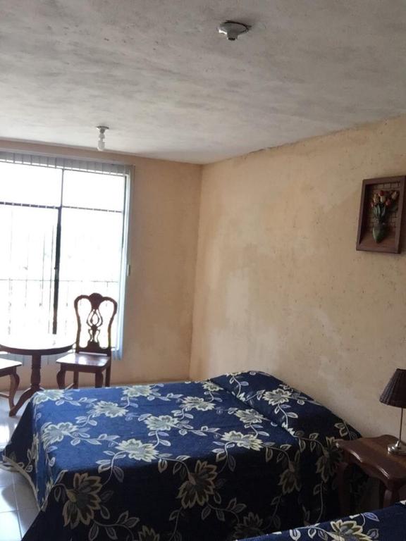Postel nebo postele na pokoji v ubytování Hotel Lienzo Charro 1