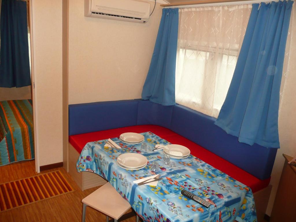 Postel nebo postele na pokoji v ubytování Camping Parco Capraro