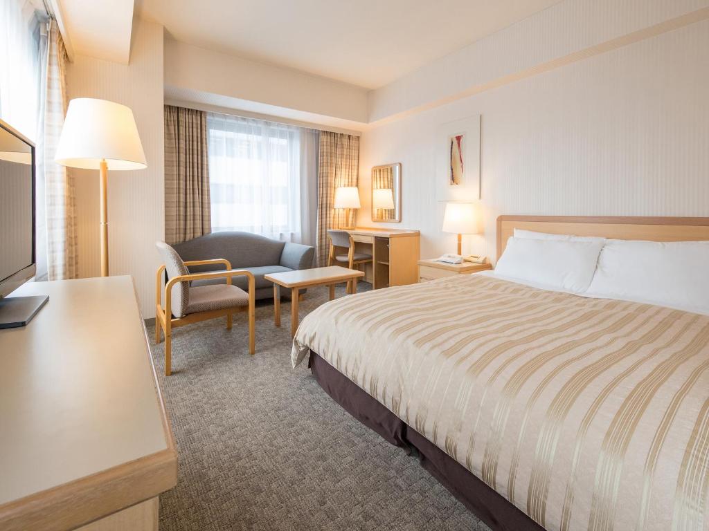 Postel nebo postele na pokoji v ubytování President Hotel Mito