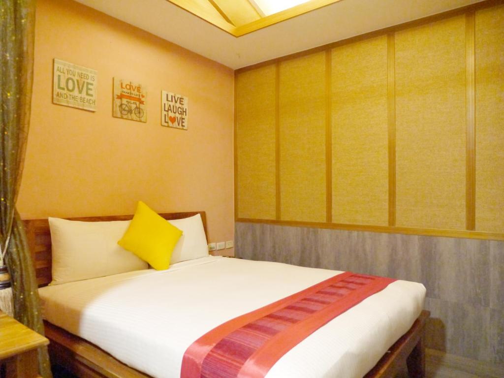 Postel nebo postele na pokoji v ubytování Kenting Sin Sin Hotel