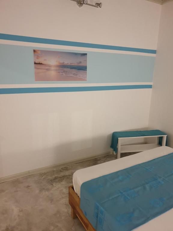 Postel nebo postele na pokoji v ubytování Casa Frangipani Mauritius