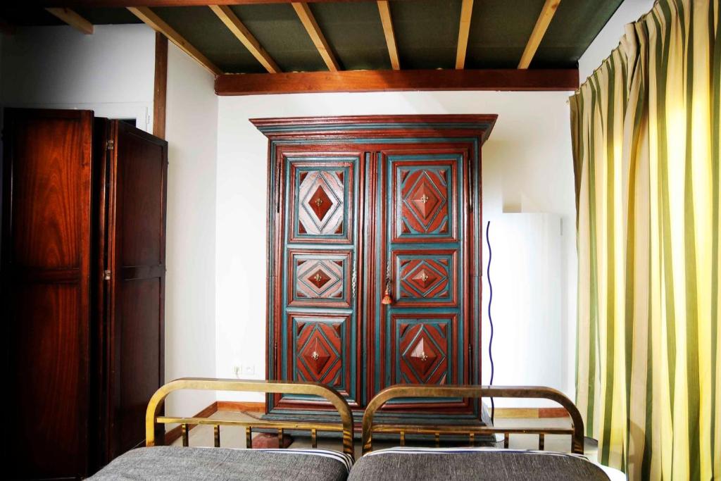 Postel nebo postele na pokoji v ubytování Chambres d'hôtes Vue sur la Muraille de Sens