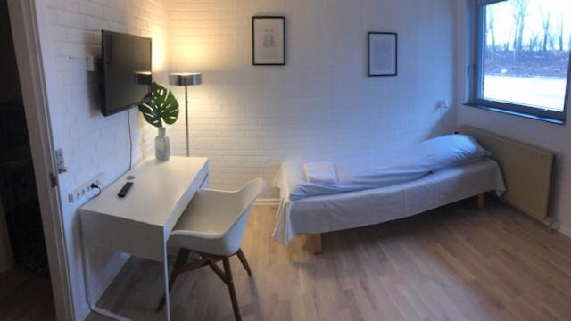 Postel nebo postele na pokoji v ubytování Herlufmagle Hallen
