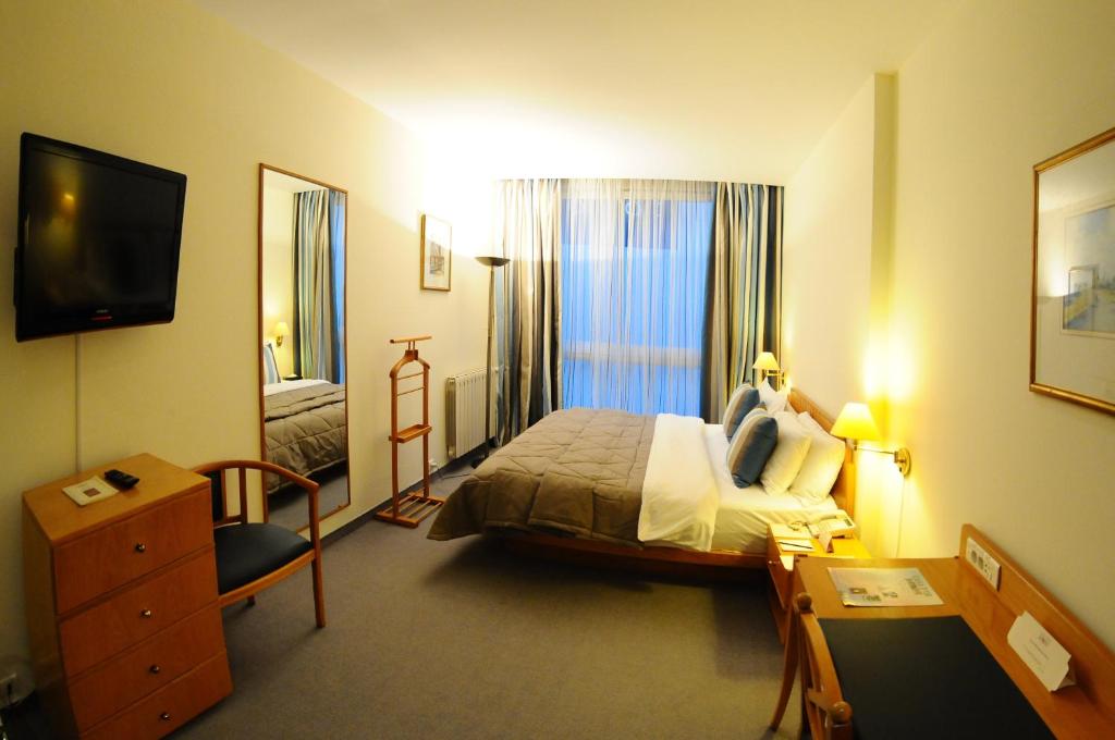 Postel nebo postele na pokoji v ubytování Casa D'or Hotel