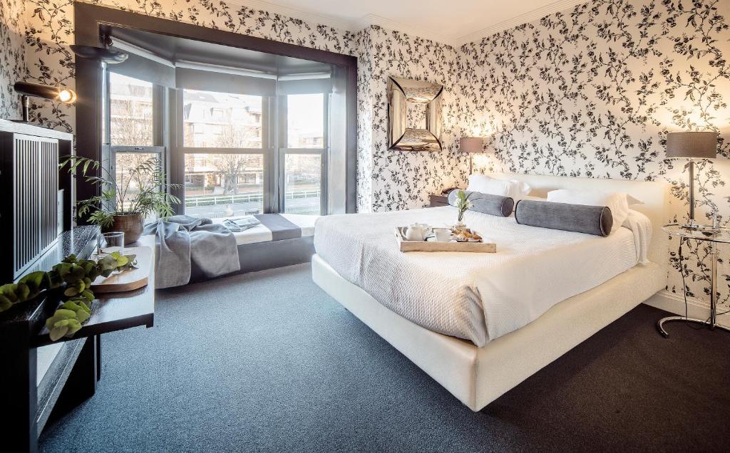 Postel nebo postele na pokoji v ubytování Ercilla Embarcadero Hotel