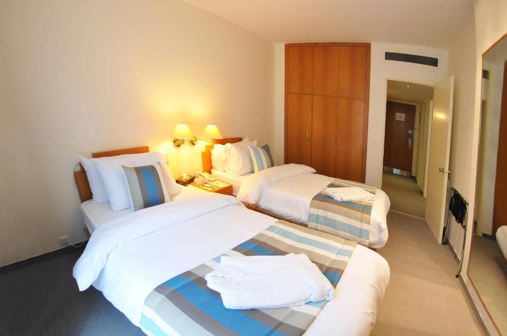 Postel nebo postele na pokoji v ubytování Casa D'or Hotel