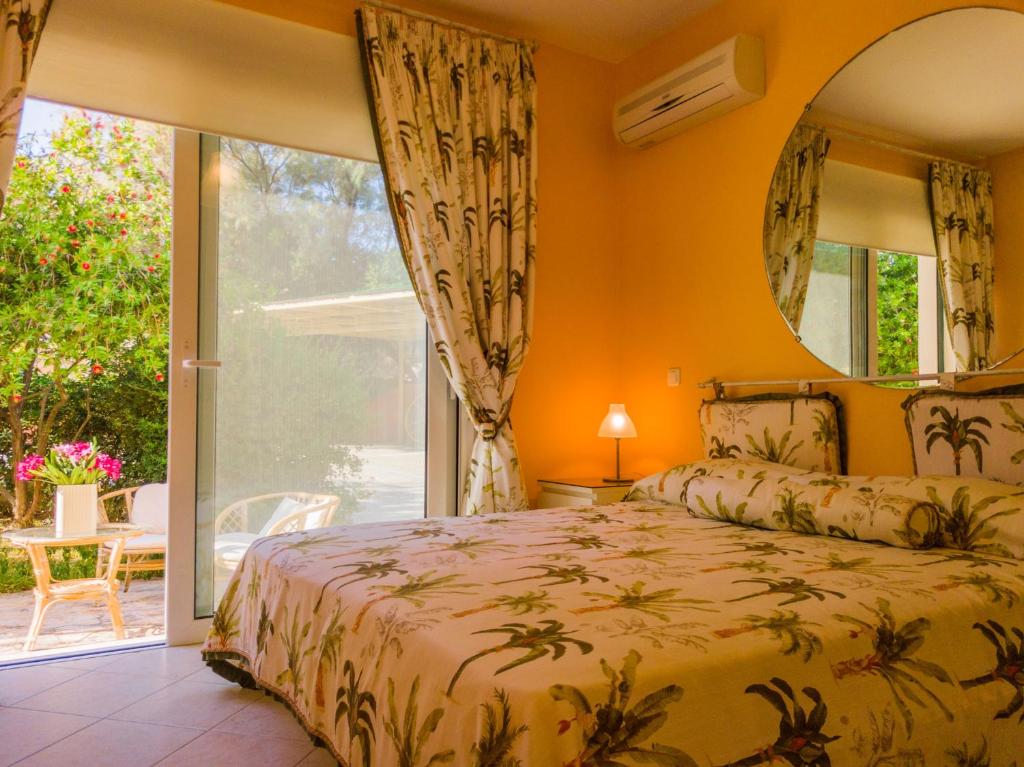 A bed or beds in a room at Kounopetra Beach Luxury Villas