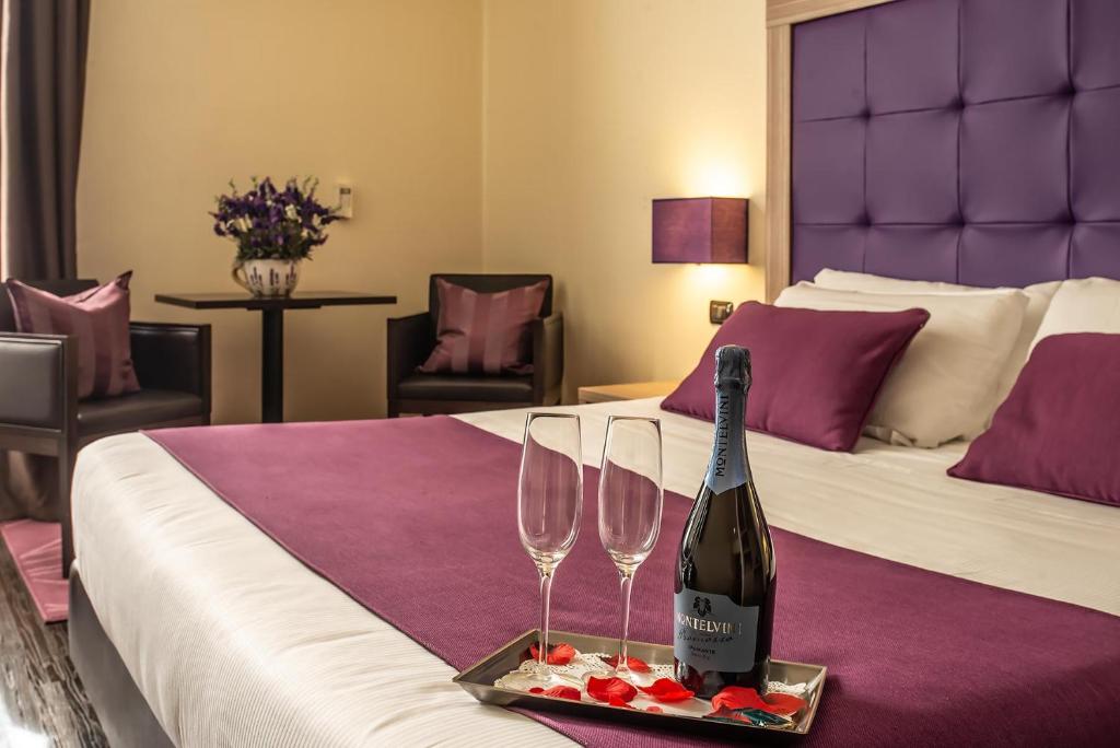 Postel nebo postele na pokoji v ubytování Hotel Roma Sud