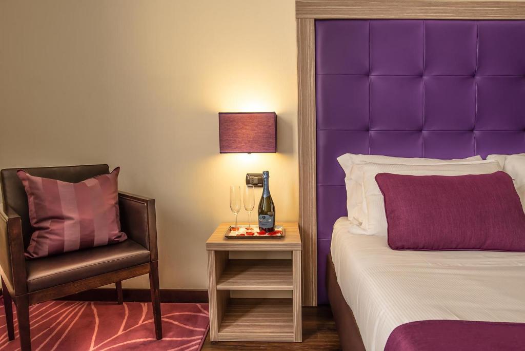 Postel nebo postele na pokoji v ubytování Hotel Roma Sud