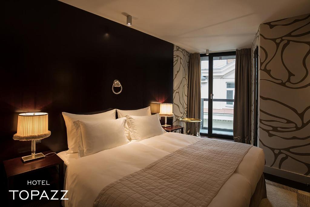 Postel nebo postele na pokoji v ubytování Hotel Topazz & Lamée